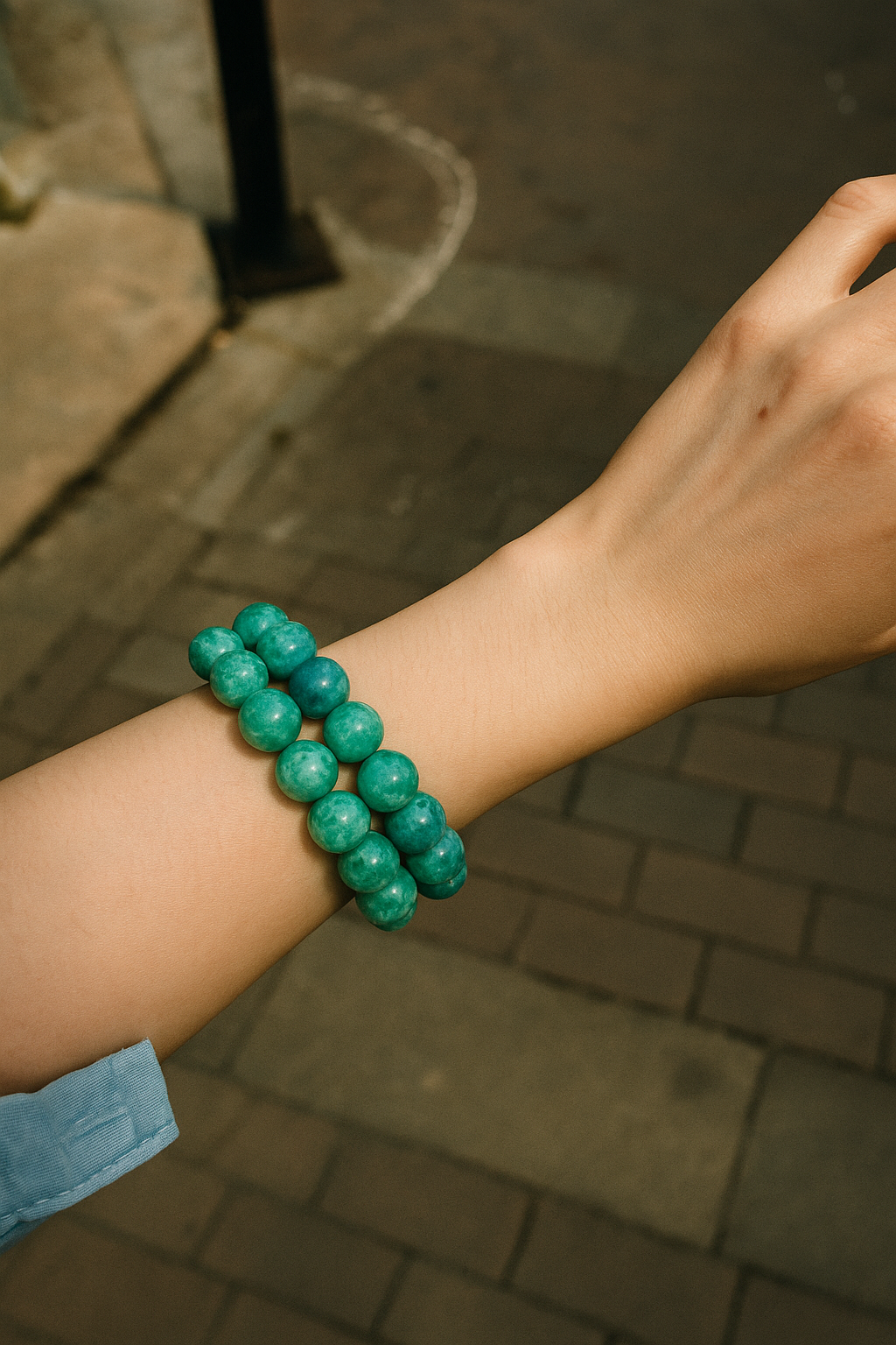 Green-blue kyanite crystal bracelet on wrist, symbolising calm, clarity, and balance — a soothing gemstone accessory for everyday elegance.