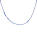 Aquamarine beaded necklace on a white background