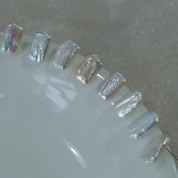Iridescent nail art designs on a white surface from Gembee Jewellery