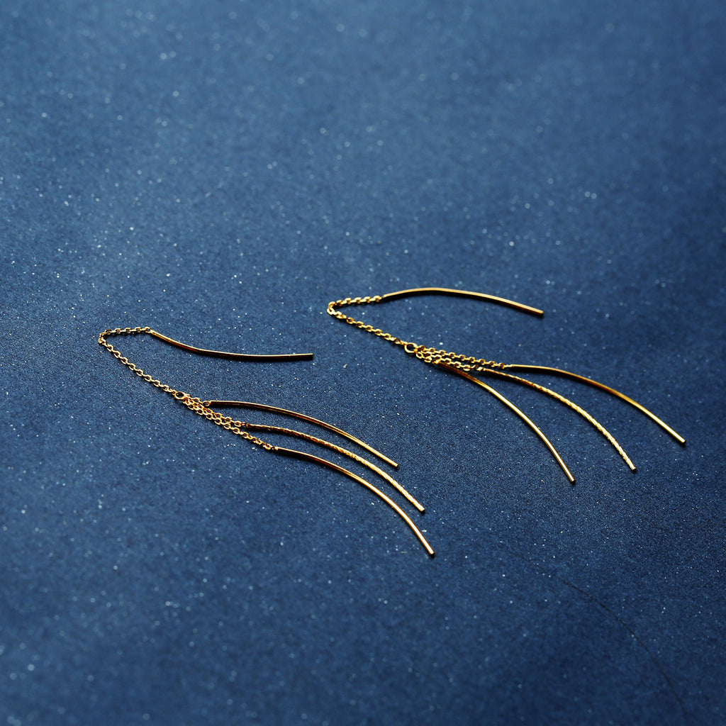 Comet_Tail_Threader_Earrings on a blue background from Gembee Jewellery
