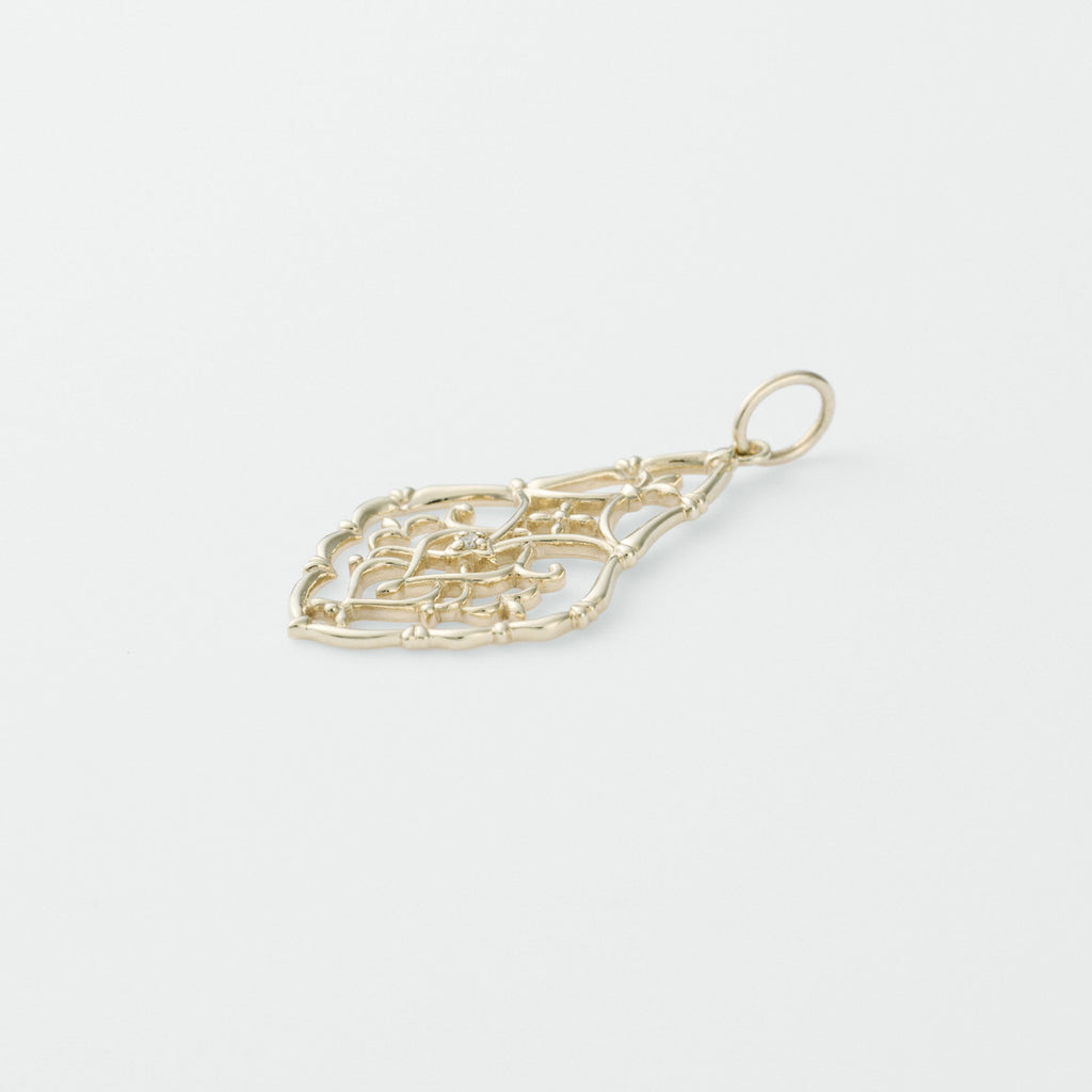 Gold pendant on a light gray background from Gembee Jewellery