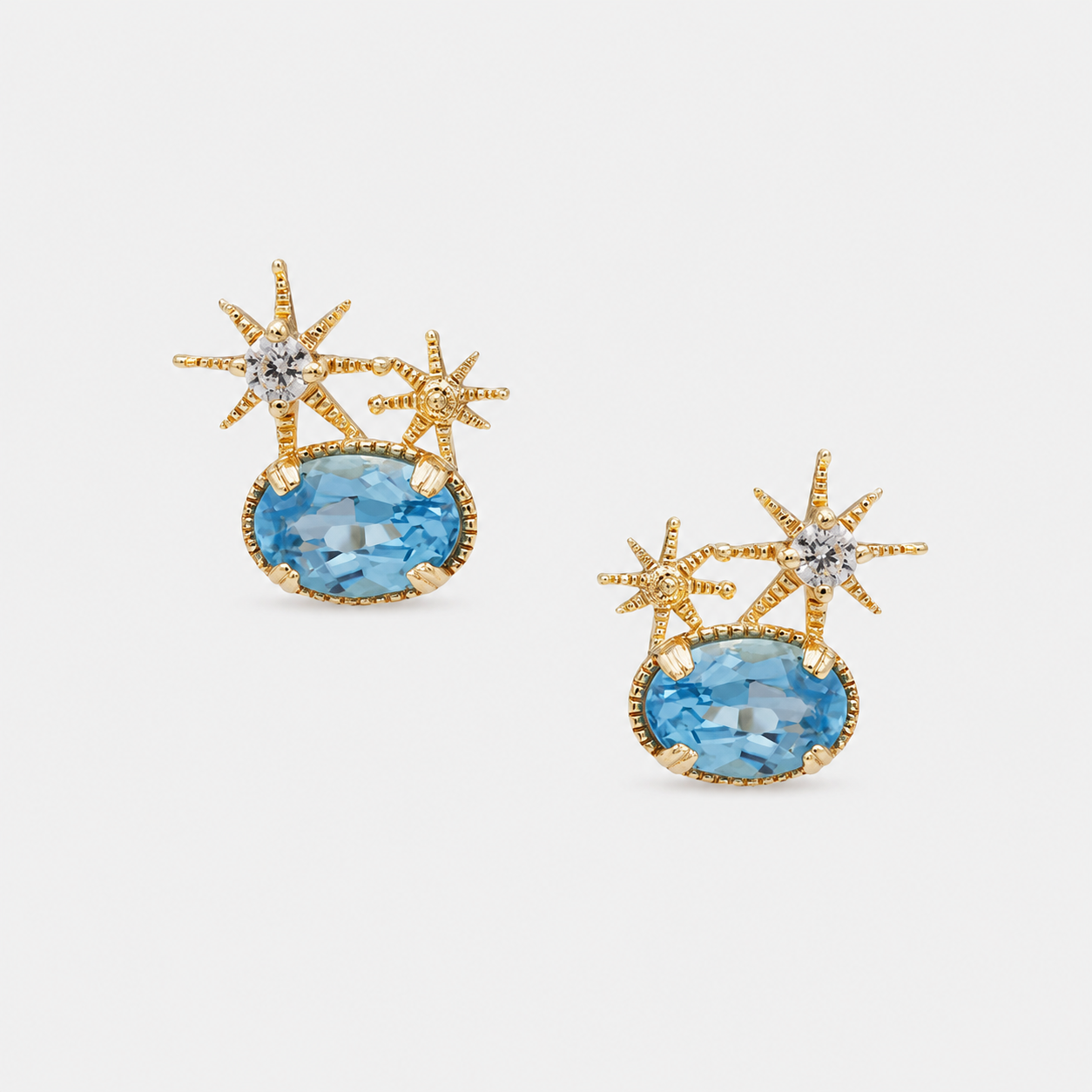 Natural Oval Swiss Blue Topaz Celestial Stud Earrings in Gold Plated Silver