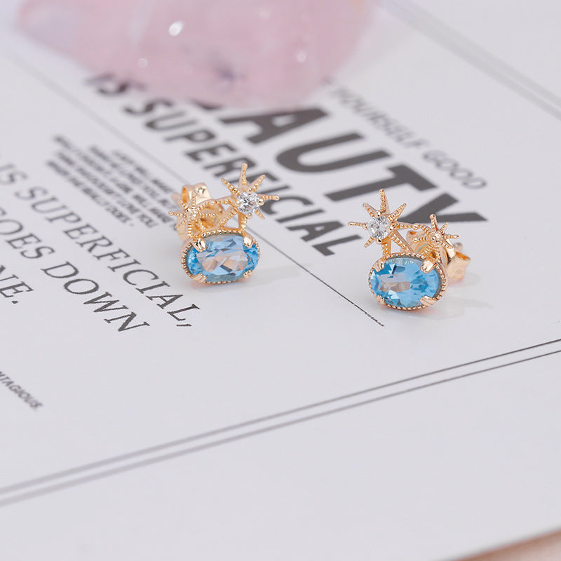 Natural Oval Swiss Blue Topaz Celestial Stud Earrings in Gold Plated Silver