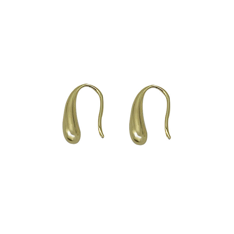 Gold earrings on a white background From Gembee Jewellery