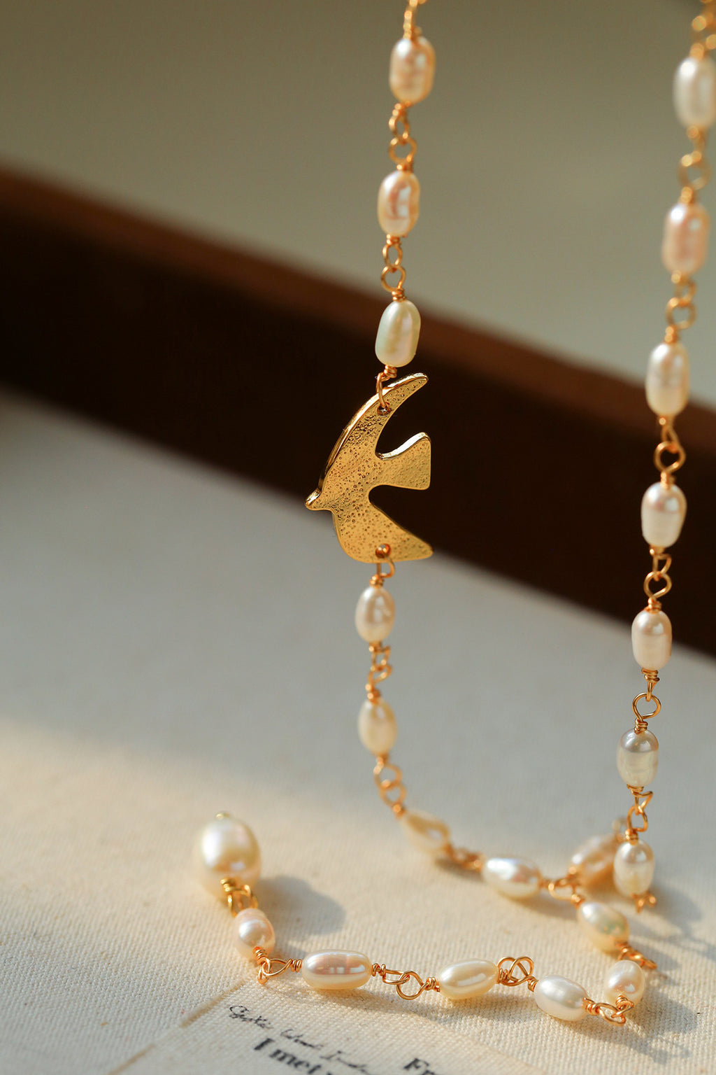 Baroque Pearl Lariat Necklace with Bird Charm